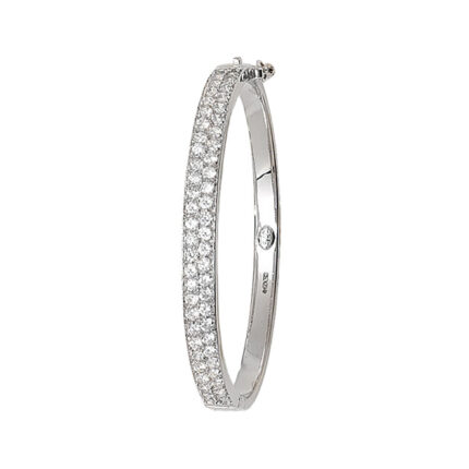 9k white gold tripple row stone set kids bangle. The bangle is solid with cubic zirconia stones.