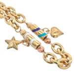 14k Yellow Gold charm bracelet for ladies and women with star and heart charms and enamel work.