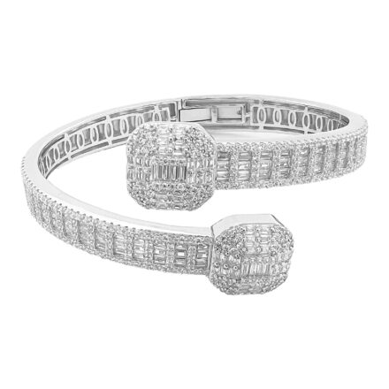 925 sterling silver cross over bangle bracelet with rectangular baguette and round stones.