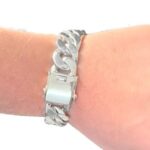 Wide and thick silver cuban bracelet with a box clasp.