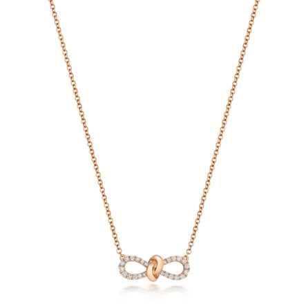 18k Rose Gold Diamond Bow Necklace for women set with 0.19 ct VS stones.