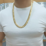 12 mm Miami cuban chain for men on a man to showcase its size with a safety box clasp.