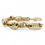 Handcrafted 9k yellow gold Stars and Bars Tulip bracelet, 15.50 mm wide with intricate star and bar patterns, polished finish, and tulip-inspired clasp.
