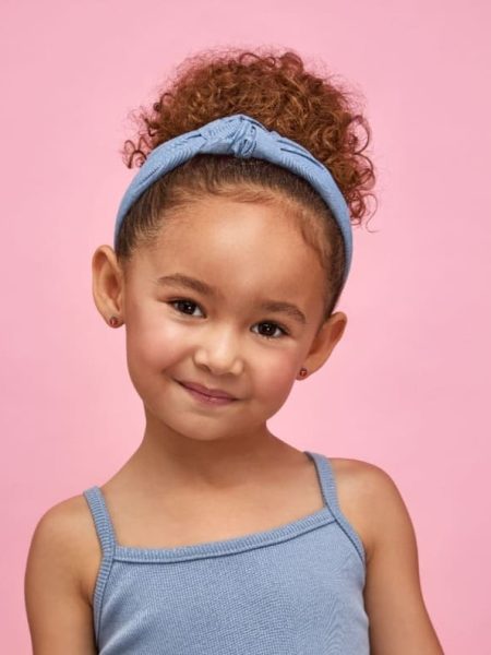 Child who got her ear piercing in Birmingham - Top Jewellery