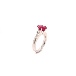 9k Custom made trilogy around the customers centre stone, a very high grade 3.0 ct Ruby stone with VVS diamonds on the sides.